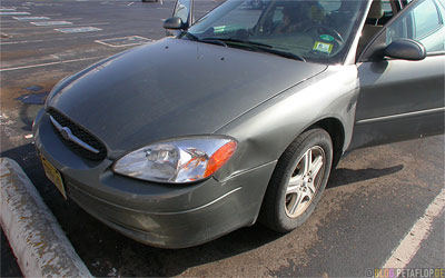 damaged-mudguard-fender-wing-Beule-im-Kotfluegel-Ford-Taurus-Station-Wagon-DSCN7338.jpg